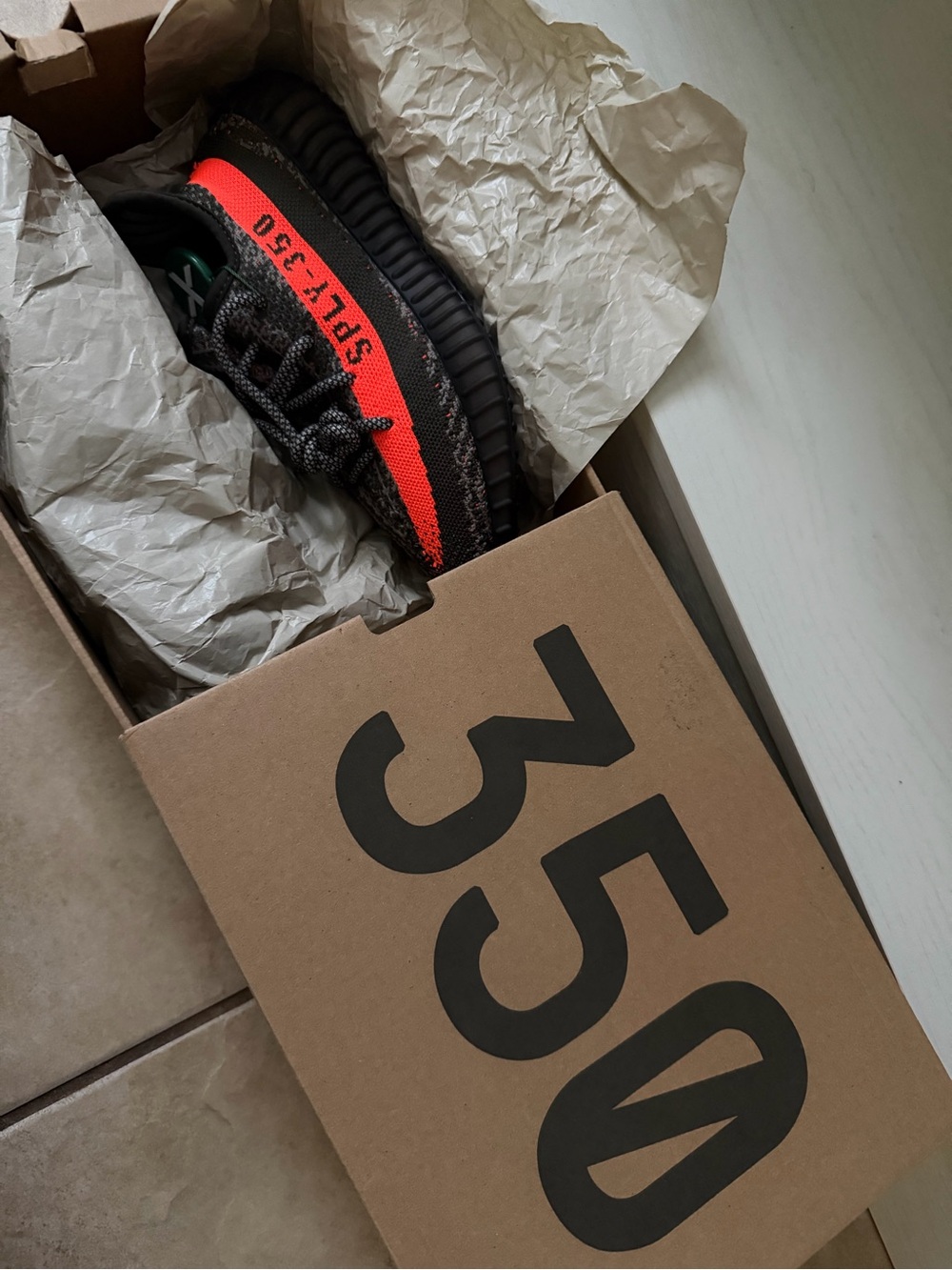 Yeezy Boost 350 V2 Black with Bright Orange Stripe